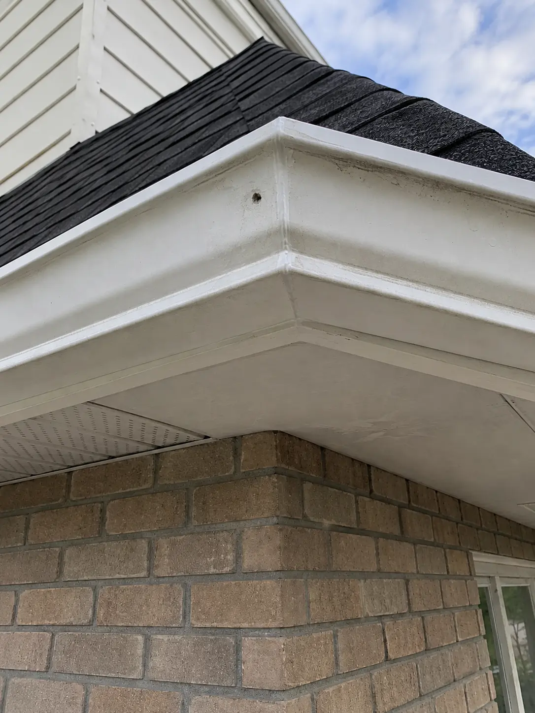 Eavestrough corner after seam repair and cleaning
