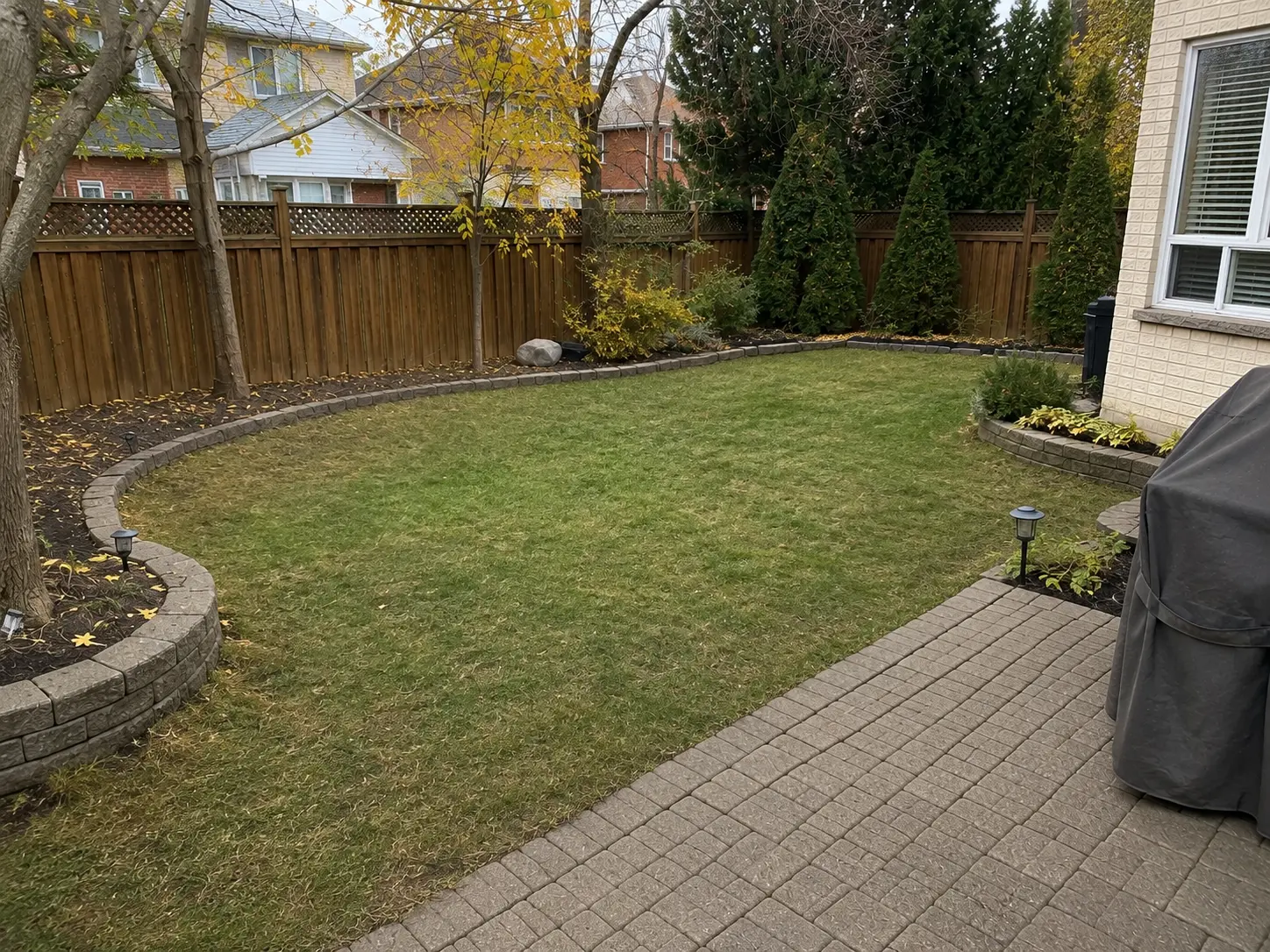 Backyard lawn and patio cleared after seasonal property cleanup